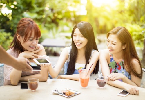 Hand holding a phone that says Mobile Wallet